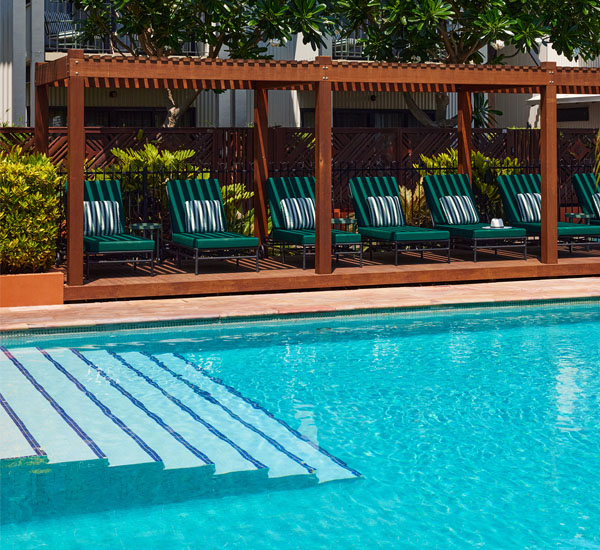 Image of poolside lounges and cabana at Pinctada Hotel Broome