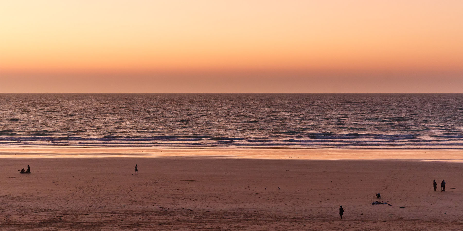 Image of an orange sunset at Cable Beach by Pinctada Hotel Broome